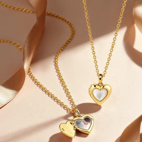 Gold heart-shaped pendants on a beige ribbon background