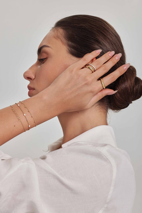 Gold Dangling Bead Station Bracelet