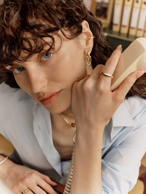 Gold Sculptural Interlocking Huggie Hoop Earrings